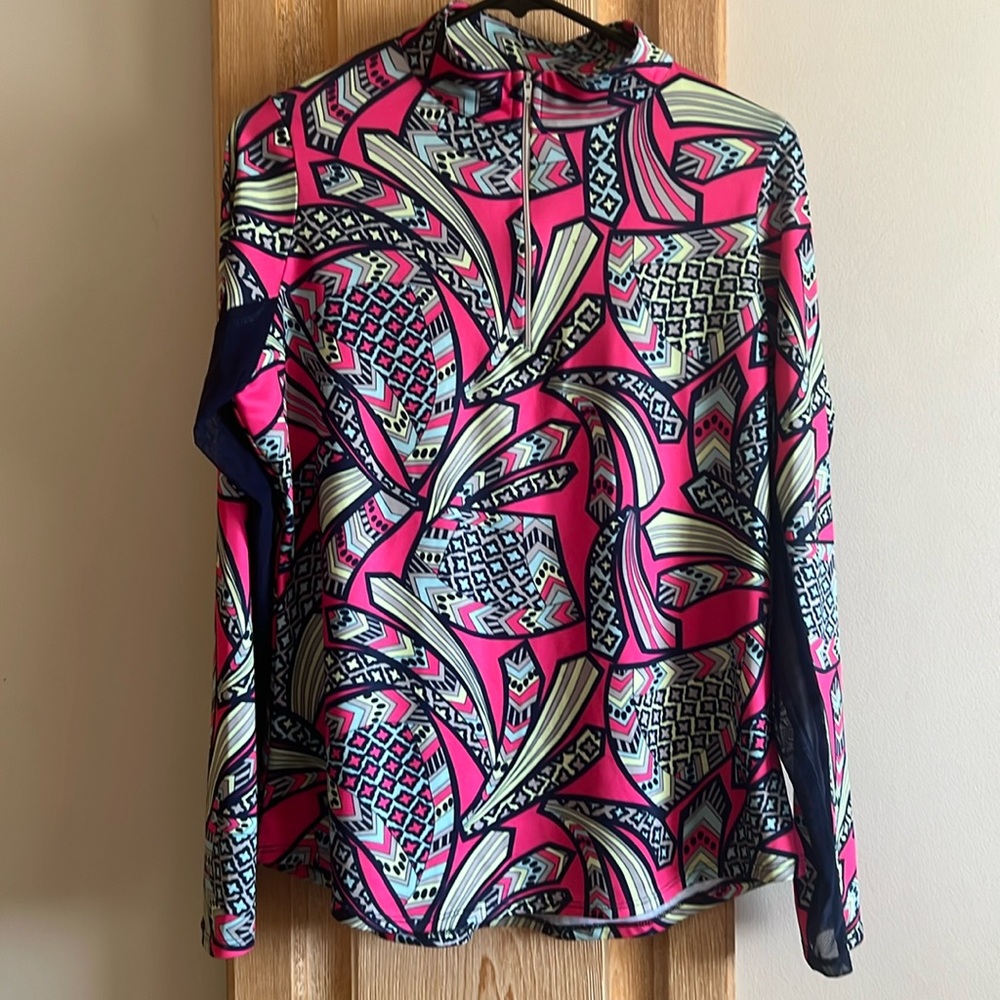 Chelsea Gunn 1/4 zip athletic top. Bright colors.